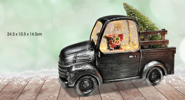Père Noël dans un camion vintage noir
