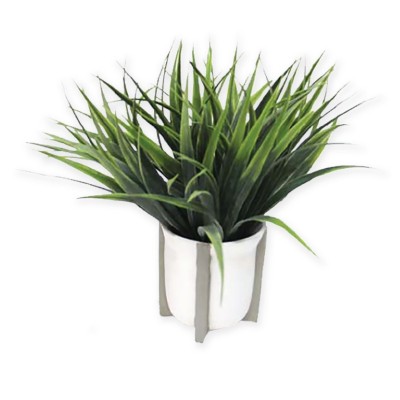 Plante artificielle dans une jardinière ronde