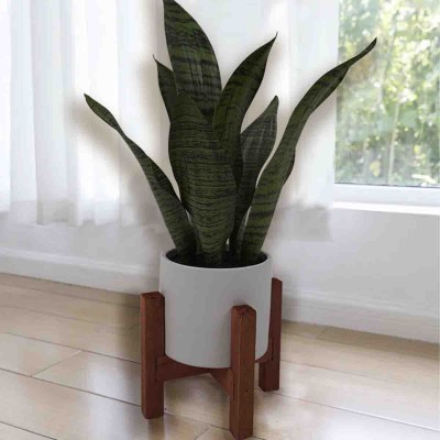 Plante serpent artificielle dans un pot en céramique avec pieds en bois