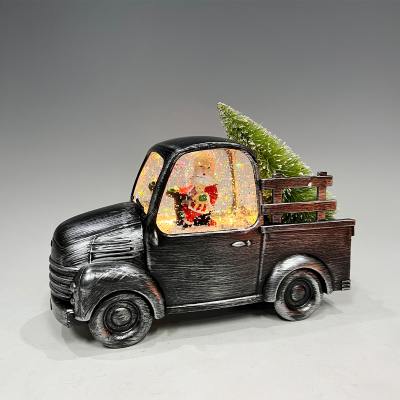 Père Noël dans un camion vintage noir